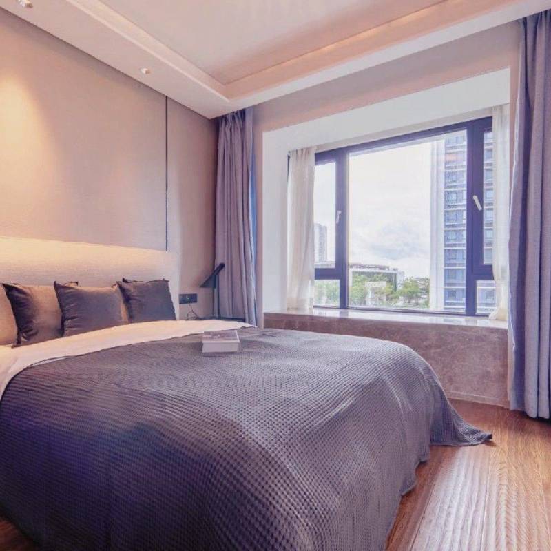 Bedroom with curtains and large windows in the 87 m² Peninsula Phase III advertiser's gallery